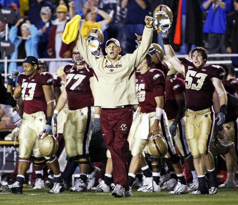 Former Boston College player Mark Herzlich, center, raises his arms after Boston College defeated Florida State 28-21 in an NCAA college football game at Alumni Stadium in Boston, Saturday, Oct. 3, 2009.
