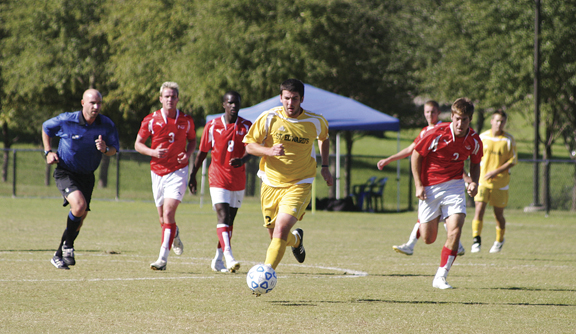 Sophomore Terry Stewart dribbles the ball up the field.
