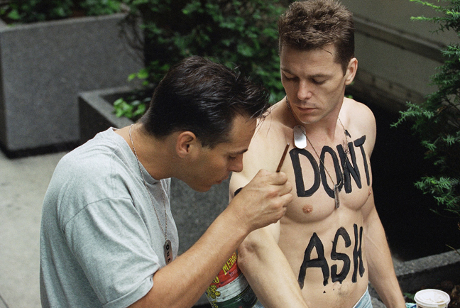 In this Sunday, June 27, 1993 file photo, a man who wished not to be identified has the slogan Dont Ask, Dont Tell painted on his torso as he prepares to march in the 24th Annual Lesbian and Gay Pride Parade in New York. Defense Secretary Robert Gates, appearing before the Armed Services Committee on Tuesday, Feb. 2, 2010, announced plans to loosen enforcement rules involving the dont ask, dont tell policy that has been in effect since 1993.
