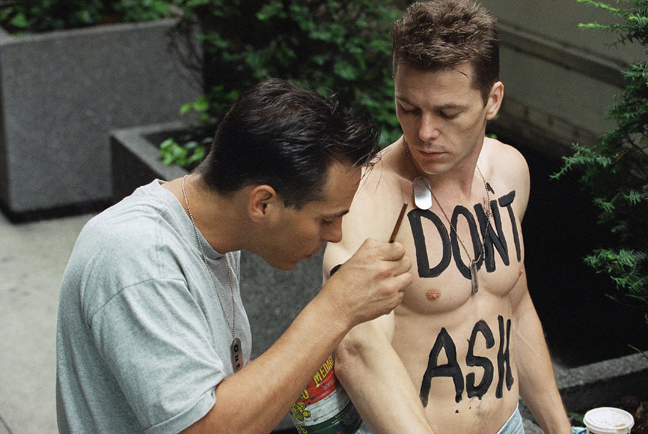 In this Sunday, June 27, 1993 file photo, a man who wished not to be identified has the slogan "Don't Ask, Don't Tell" painted on his torso as he prepares to march in the 24th Annual Lesbian and Gay Pride Parade in New York. Defense Secretary Robert Gates, appearing before the Armed Services Committee on Tuesday, Feb. 2, 2010, announced plans to loosen enforcement rules involving the "don't ask, don't tell" policy that has been in effect since 1993.
