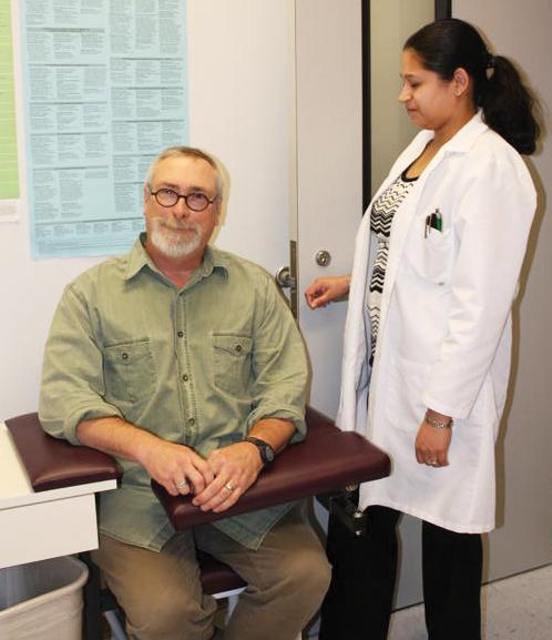 Professor Edward Shirley gets an H1N1 flu shot during last year’s outbreak.
