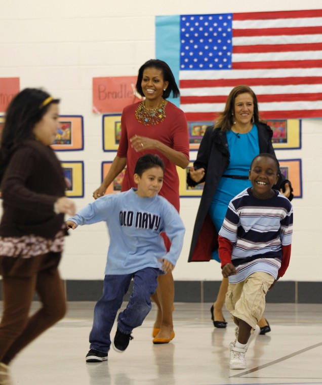 Michelle Obama runs with kids in New Hampshire.
