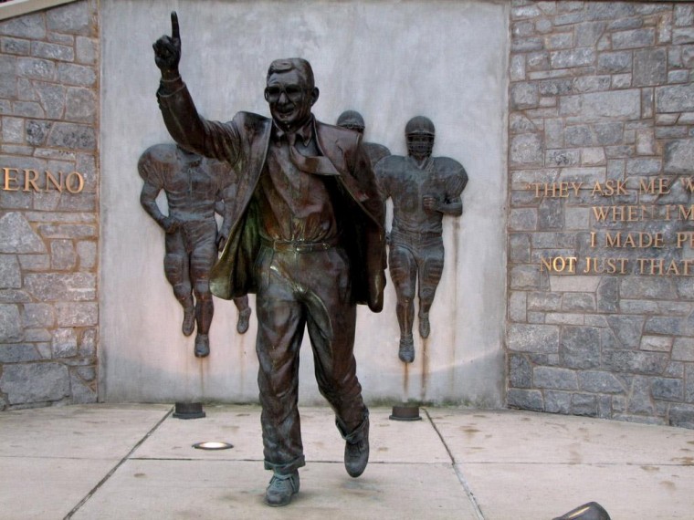 A statue of Joe Paterno stands outside Beaver Stadium.
