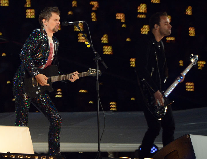 Muse frontman Matthew Bellamy, left, and bassist Chris Wolstenholme perform at the Olympic Stadium inLondon, England, during the Closing Ceremony for the London 2012 Summer Olympic Games, Sunday, August 12, 2012. 
