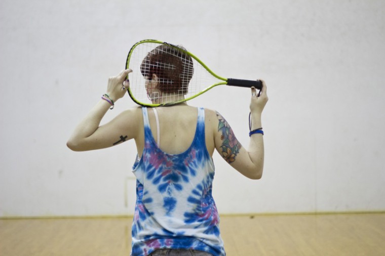 A student playing racquetball in the Recreation and Convocation Center.
