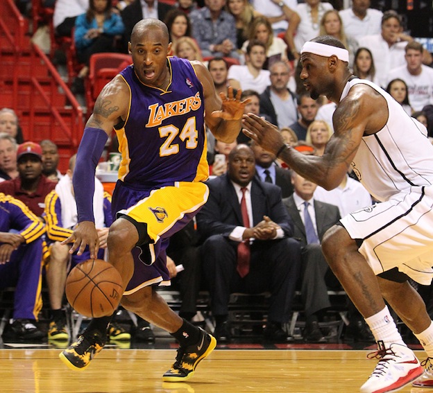 Kobe Bryant of the Los Angeles Lakers drives to the basket against LeBron James of the Miami Heat during the second quarter at the AmericanAirlines Arena in Miami, Florida on Sunday, February 10, 2013. 
