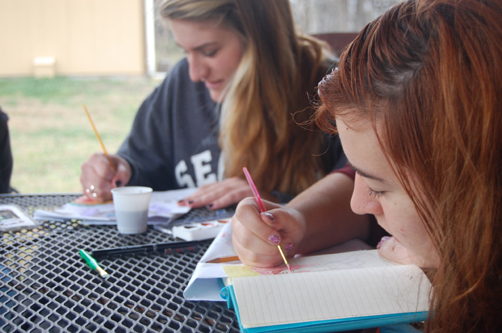 Freshmen Kelley Kantz (left) and Kaitlin Burke watercolor during their free time.
