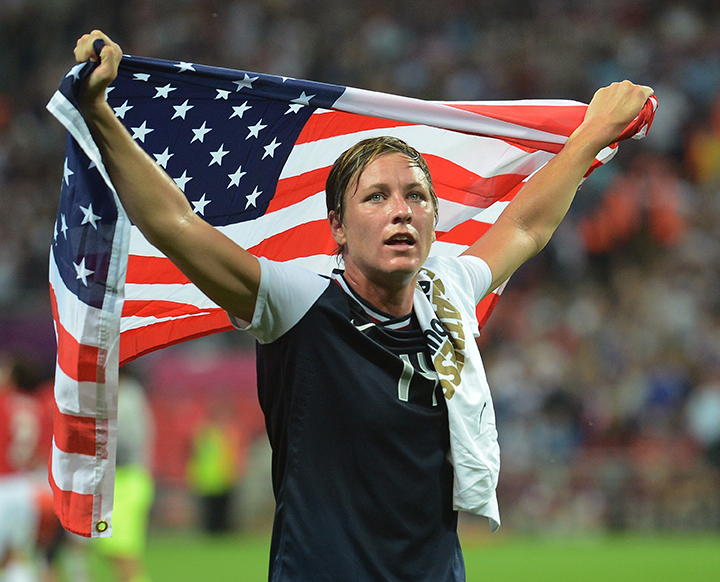 USA forward Abby Wambach celebrates with a U.S. flag following a 2-1 victory over Japan in the Olympics womens soccer final at Wembley Stadium in London, England, Thursday, August 9, 2012. 
