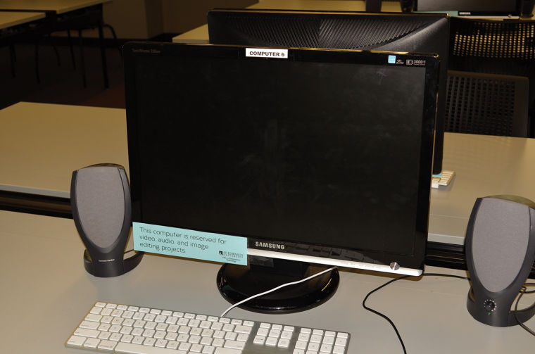 The media center has computers reserved for specific projects.