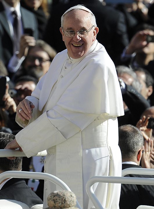 Pope Francis waves to the crowd from the Popemobile during his inauguration mass at St Peters square on March 19, 2013 at the Vatican. 