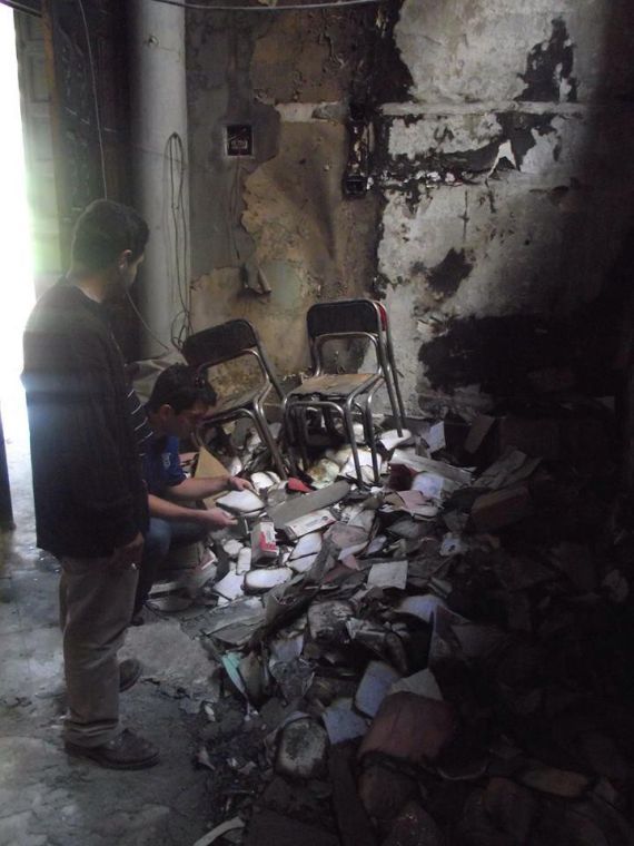 Rev. Gavin Rogers and Matthew Aragones visit a burned church in Egypt. 