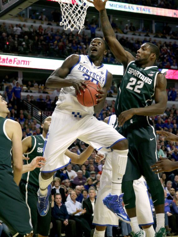 Julius Randle of Kentucky goes up for a basket in front of Branden Dawson (22) of Michigan State on Tuesday, Nov. 12, 2013, at the United Center in Chicago. Michigan State won, 78-74.