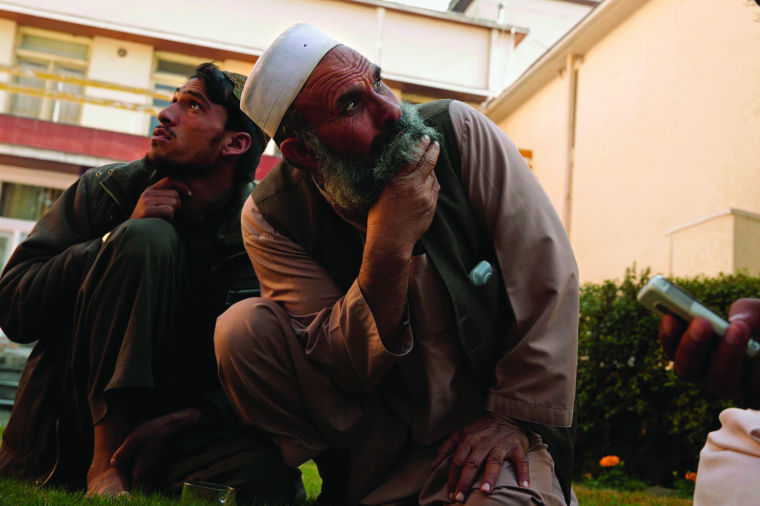 Citizens in Afghanistan watch as drones fly over the country.