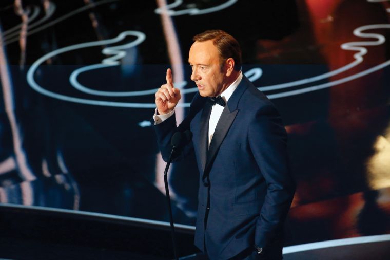 Kevin Spacey on stage during the 86th annual Academy Awards on Sunday, March 2, 2014, at the Dolby Theatre at Hollywood & Highland Center in Los Angeles.