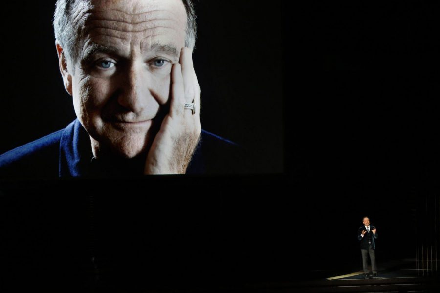 Comedian Billy Crystal, bottom right, pays tribute to the late Robin Williams during the 66th Annual Primetime Emmy Awards at Nokia Theatre at L.A. Live in Los Angeles on Aug. 25, 2014.