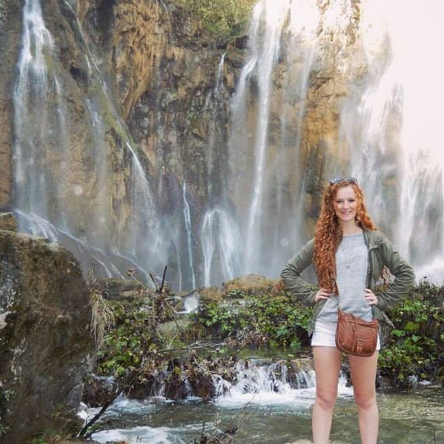 Standing below the final waterfall at the Plitvice Lakes National Park, Croatia.