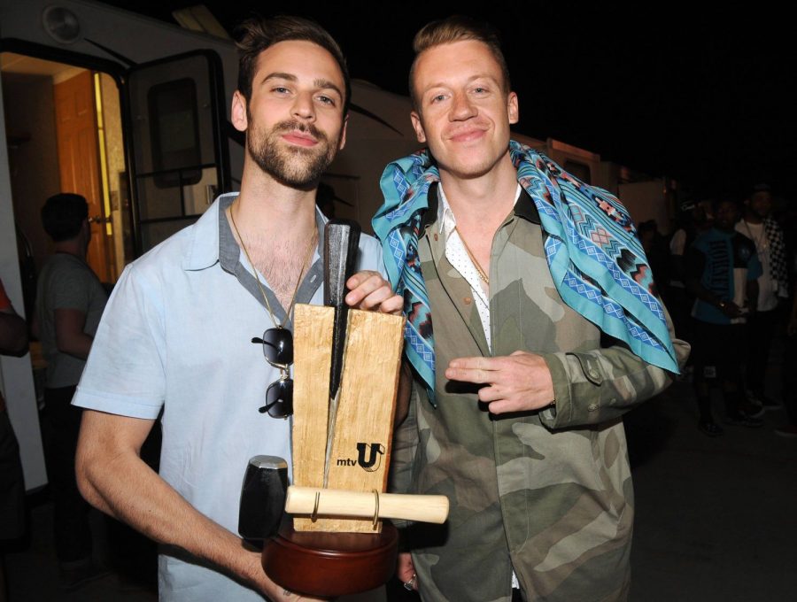 Ryan Lewis, left, and Macklemore pose backstage with the Branching Out Woodie at the mtvU Woodie Awards on Thursday, March 14, 2013, in Austin, Texas. 