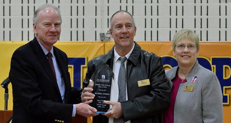 Sterns (center) was officially inducted into the St. Edwards Athletics Hall of Fame by President George E. Martin (left) and Athletic Director Debbie Taylor (right) on Feb. 28.