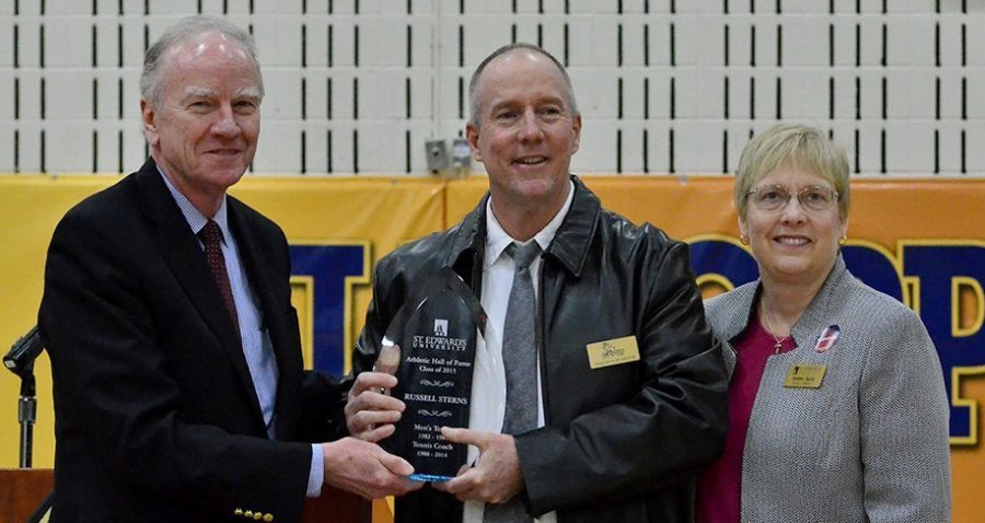 Sterns (center) was officially inducted into the St. Edward's Athletics Hall of Fame by President George E. Martin (left) and Athletic Director Debbie Taylor (right) on Feb. 28.