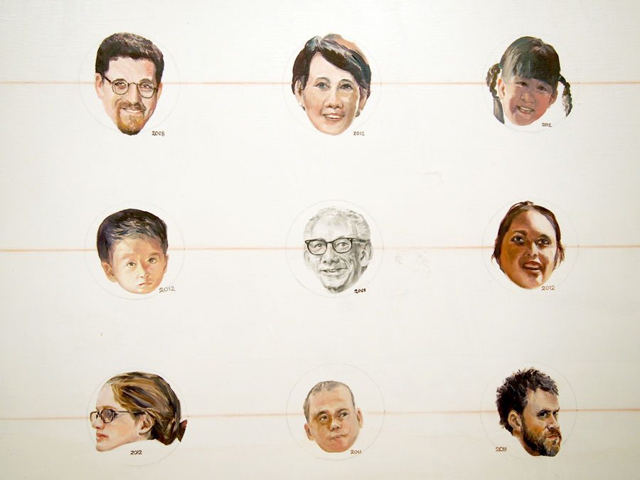 A small segment of Martin Lam Nguyen's massive canvases which contain over 1000 small portraits.