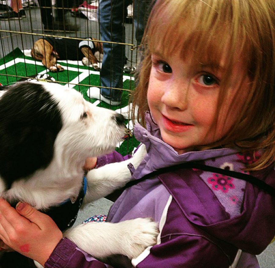 ​Kinley Alton (age 6) - adoptee holding Jasmine (boarder collie mix)