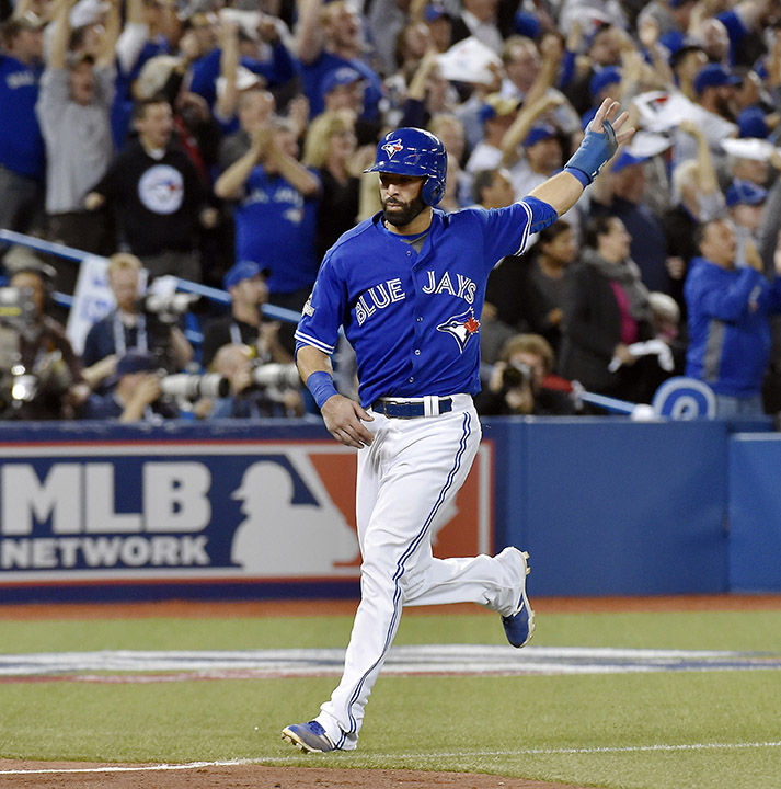 The Toronto Blue Jays Jose Bautista scores on a three-run double by Troy Tulowitzki against the Kansas City Royals in the sixth inning during Game 5 of the ALCS on Wednesday, Oct. 21, 2015, at Rogers Centre in Toronto. The Blue Jays won, 7-1, leaving the Royals with a 3-2 series lead. (John Sleezer/Kansas City Star/TNS)