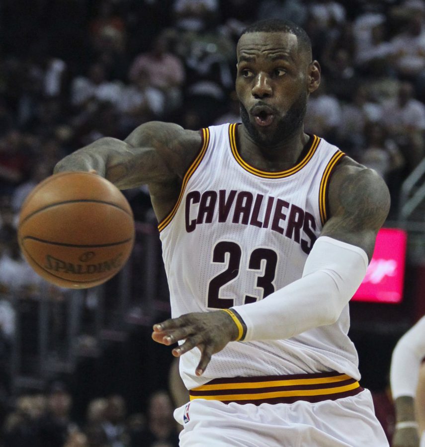 Cleveland forward LeBron James fires a pass to a teammate during the third quarter on Sunday, April 17, 2016, at Quicken Loans Arena in Cleveland, Ohio. 