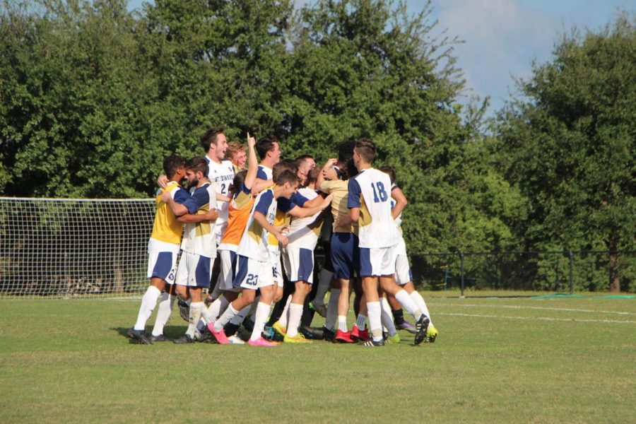 The+St.+Edwards+mens+soccer+team+celebrates+its+first+NCAA+Tournament+victory+in+program+history+on+Nov.+12.