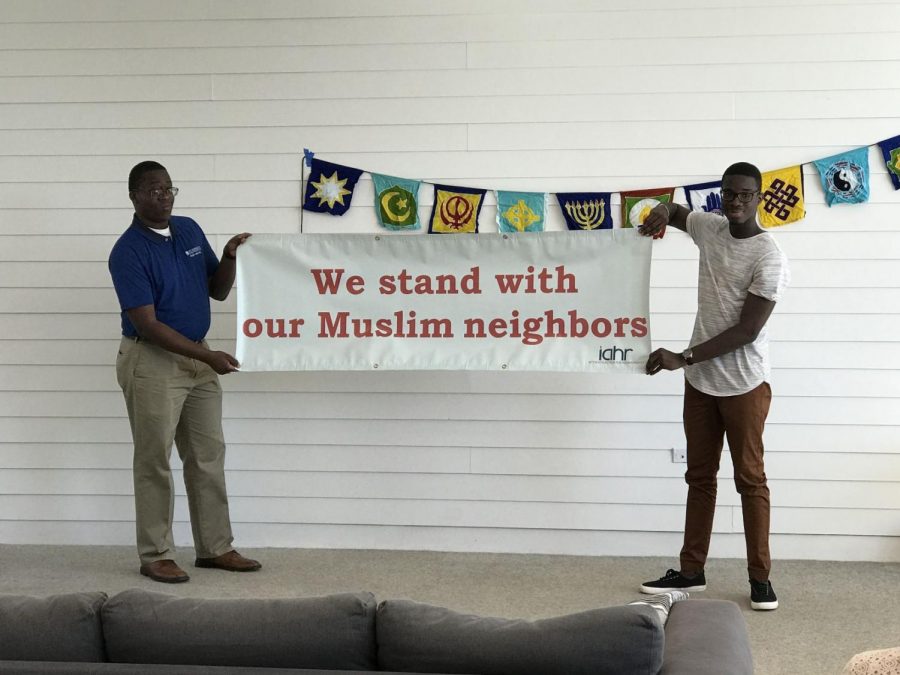 Jonathan Edwards (left) and Abraham Bassam (right) unveiled ILC’s banner at the social.