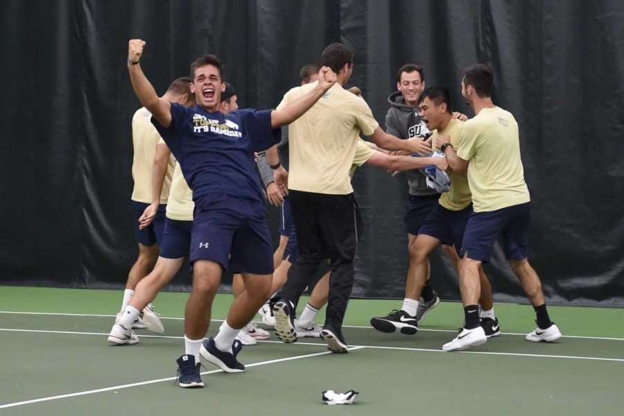 Mercado's (second from right) singles victory secured the win for SEU in the Heartland Conference Championship