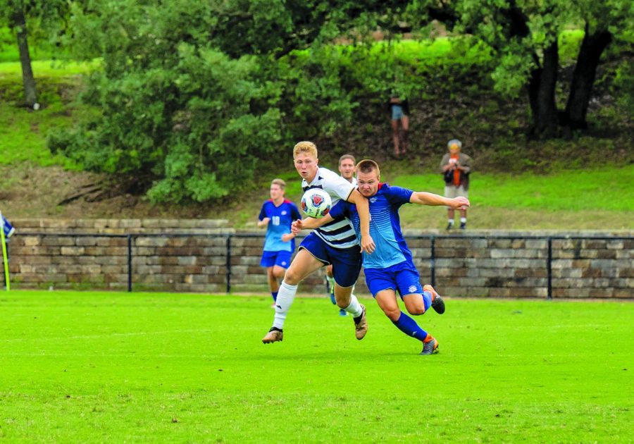 Matthew Parker (left) fights for a loose ball. 