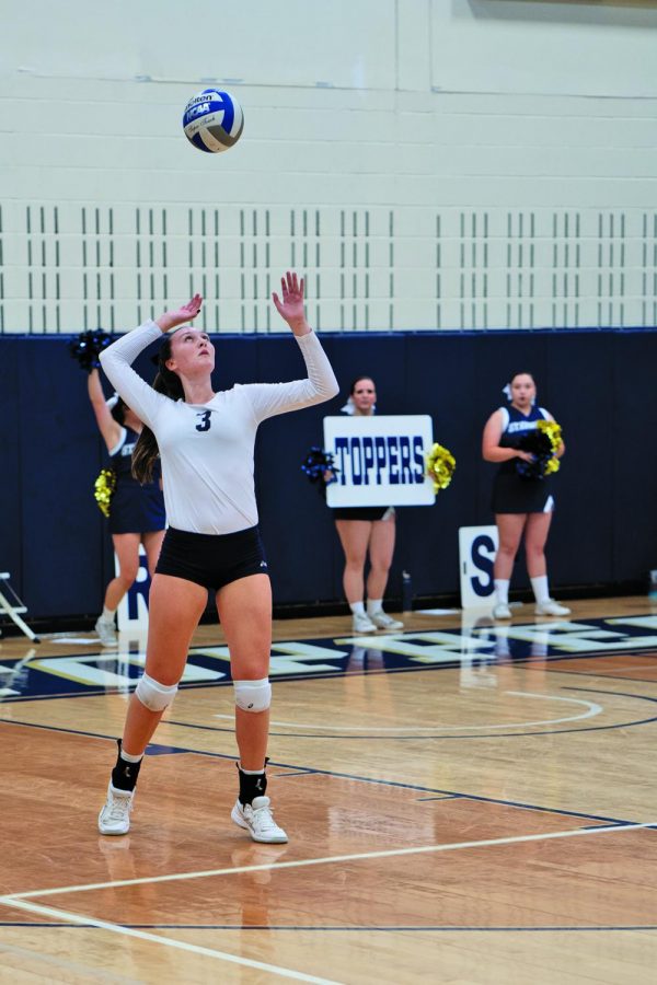 Melissa McNeil serves against Texas A&M International University. 