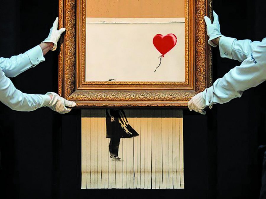 Banksy+Strikes+Again%3A+%241.4+million+artwork+shredded+in+rebellious+stunt