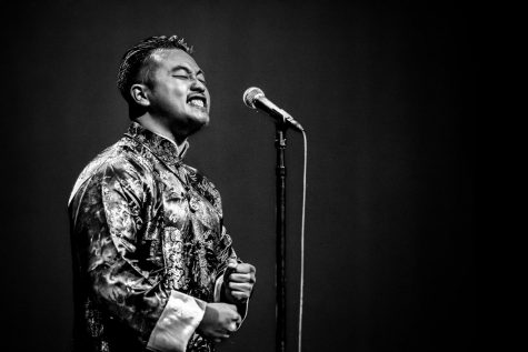 Alex Luu performing at the Texas Grand Slam Poetry Festival. Courtesy of Christopher Diaz