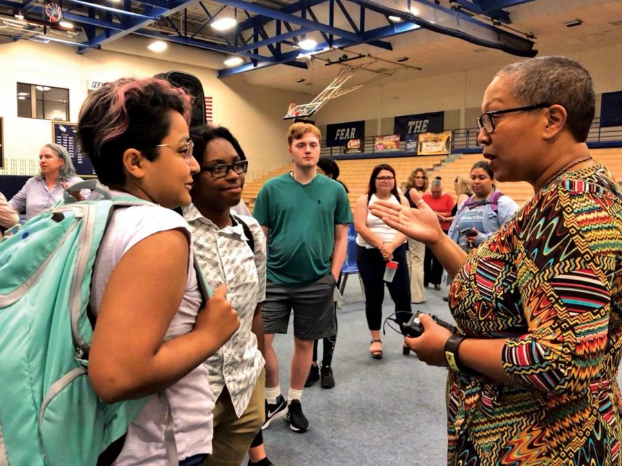 Eliaichi Kimaro discusses her speech with students