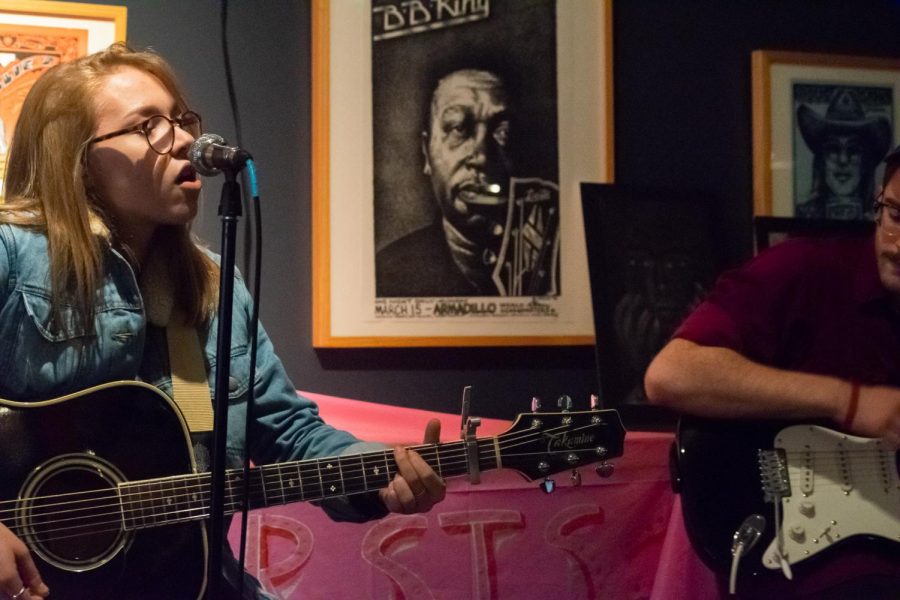 Student musical duo PEACELOVE performs for the crowd. 