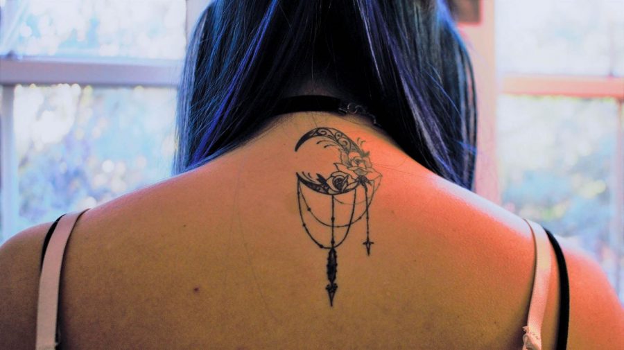 The crescent moon on Jimenez’s tattoo is inspired by her family’s frequent camping trips. 