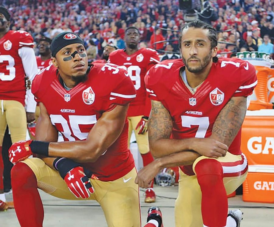 Eric+Reed+%28left%29+and+Colin+Kaepernick+%28right%29+both+make+a+bold+statement+by+kneeling+for+National+Anthem+before+an+NFL+game.