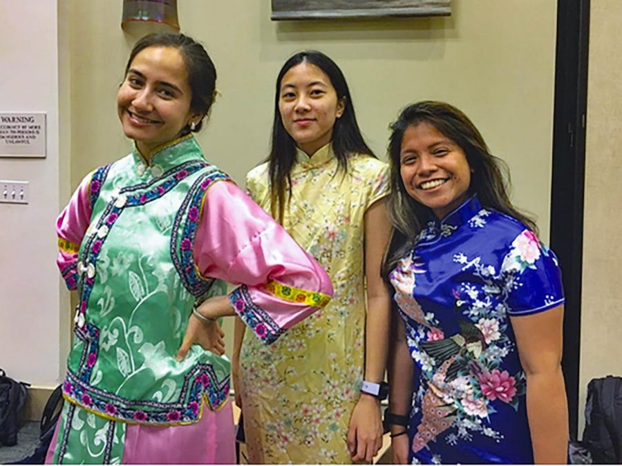 SEU students pose in traditional Chinese cheongsams. 