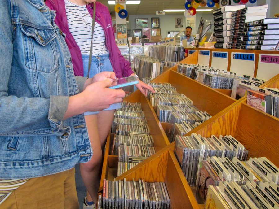 Patrons of Antone’s Record Store comb through the seemingly endless stacks of music. The store is located on Guadalupe St., north of West Campus, and is open every day.  