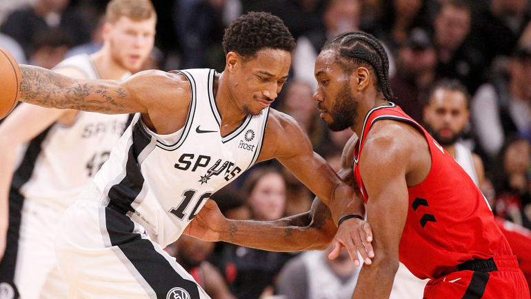 Kawhi Leonard (right) and Spurs shooting guard Danny Green were both traded to Toronto for Raptors shooting guard DeMar DeRozan (left)