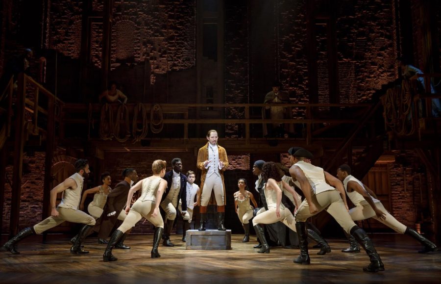 The company of Hamilton and Joseph Morales performing on stage. The show is currently being performed at Bass Music Hall in Austin.