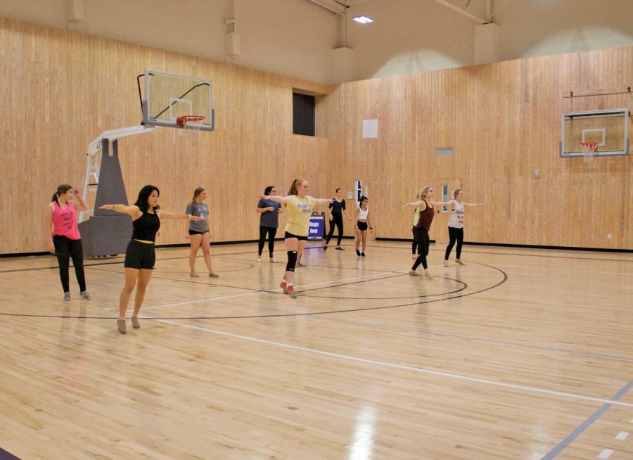 Dancers practice technique at Topperette tryouts. The dance team welcomes a new coach for the 2019-20 academic year. 