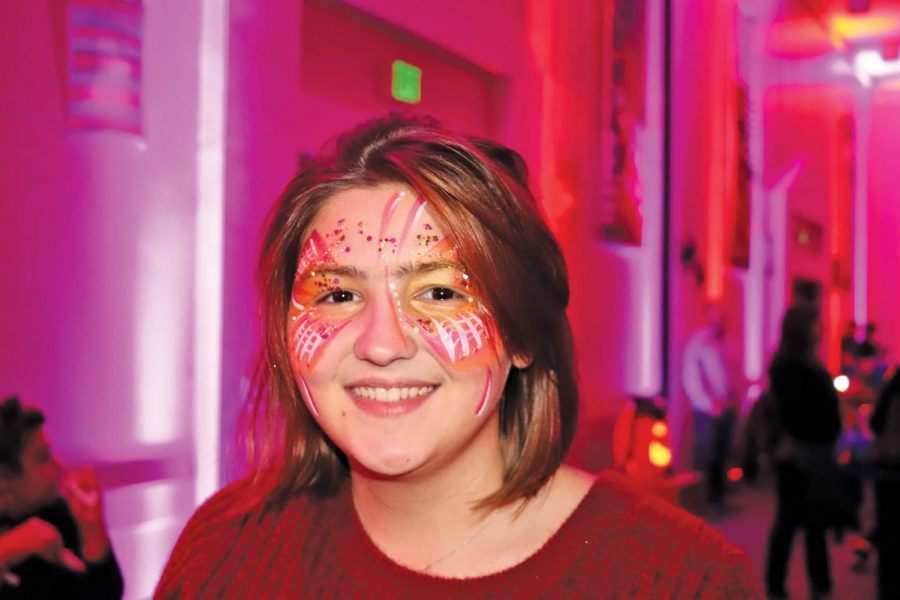 Hailey Beuhler shows off her face paint that she got at the event. Halloscream offered other festive activities including magic wand building, cape making and cookie decorating to help get visitors into the holiday mood.