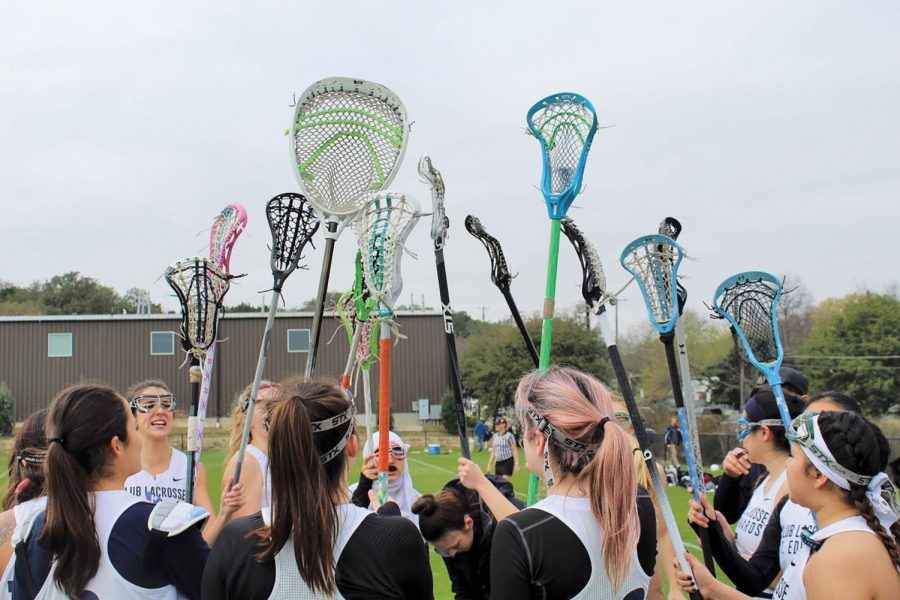 Huddling up after a productive team practice, the women’s lacrosse team prepares to improve their skillsets in preparation for upcoming tournaments. 