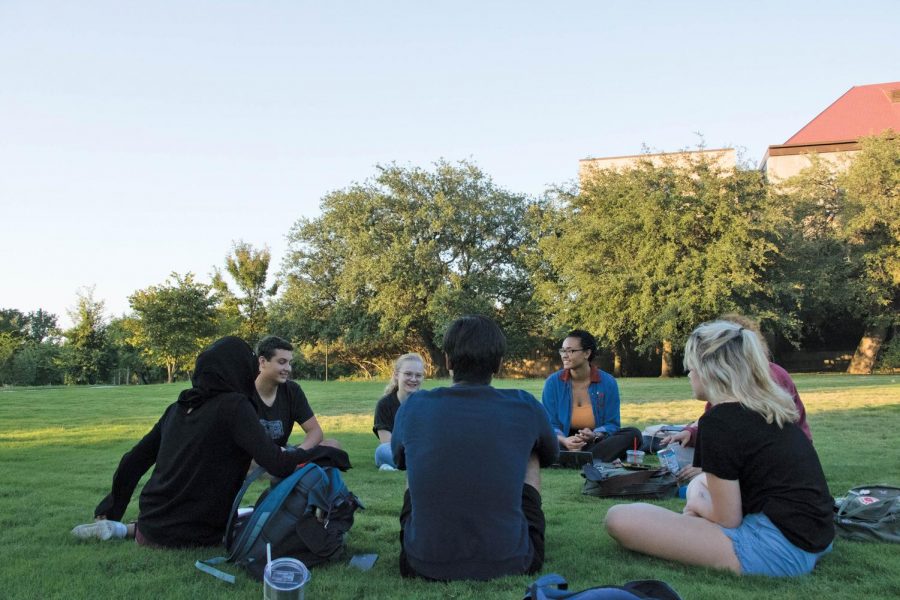 Students from AISEC, a club that provides students with study abroad opportunities, hold their meeting outside Trustee Hall. AISEC is one of more than 100 student organizations at St. Edward’s.