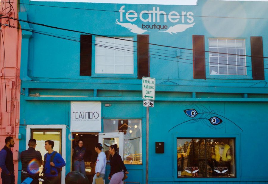 Window-shopping passersby can easily notice the current trends brought to life through vintage pieces in the colorful display of Feathers Boutique. 