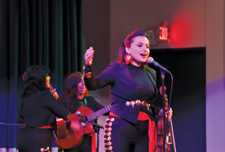 Vanessa del Fierro  leads the Las Coronelas in song and dance. Del Fierro founded the band back in 2010.