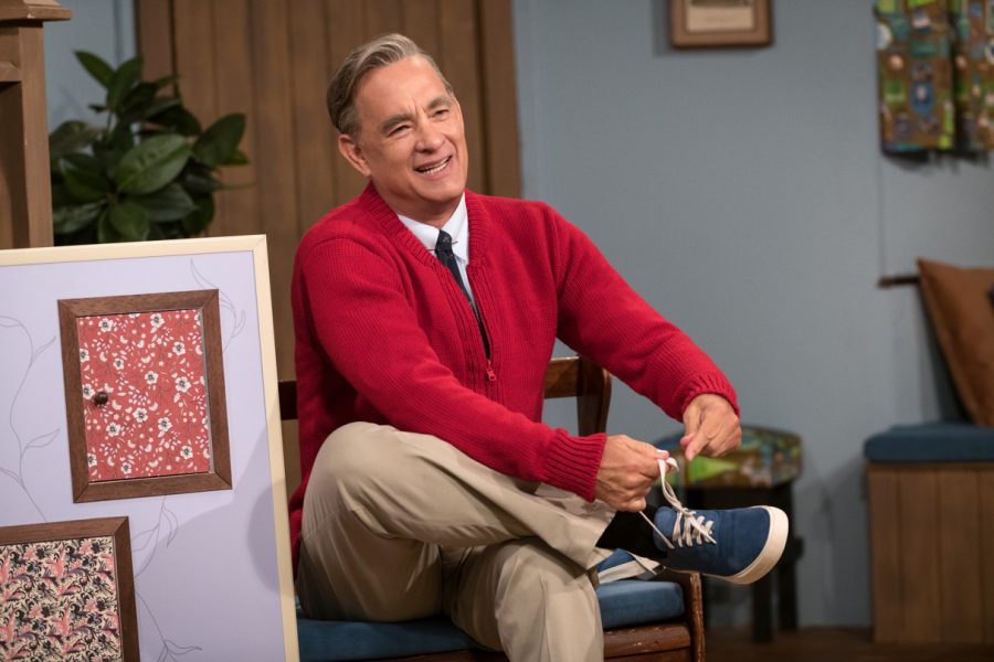 Tom Hanks stars as Fred Rogers in A Beautiful Day In The Neighborhood. Rogers passed away in 2003 from complications of stomach cancer.