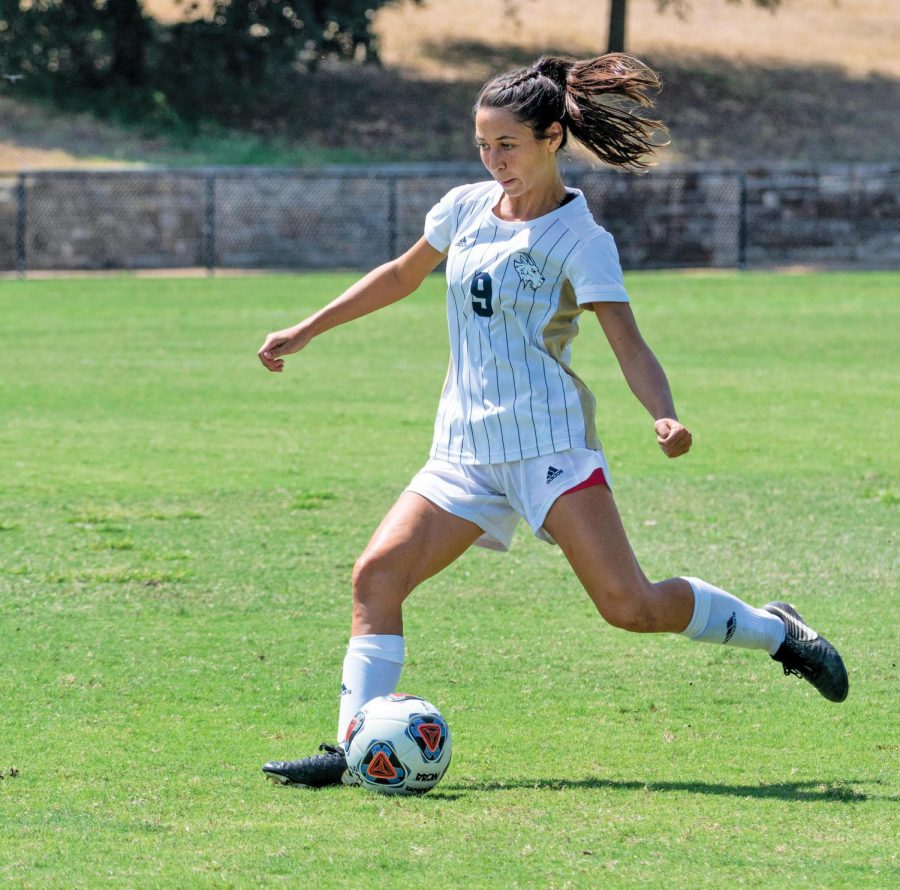 Jenna Lipscomb sets up an open teammate during a home match. Lipscomb is a senior and a fundamental part in the team's top spot in conference. 